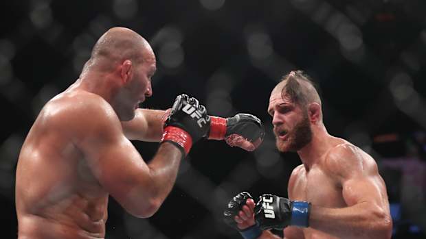 Glover Teixera (red gloves) fights Jiri Prochazka (blue gloves) during UFC 275 at Singapore Indoor Stadium.